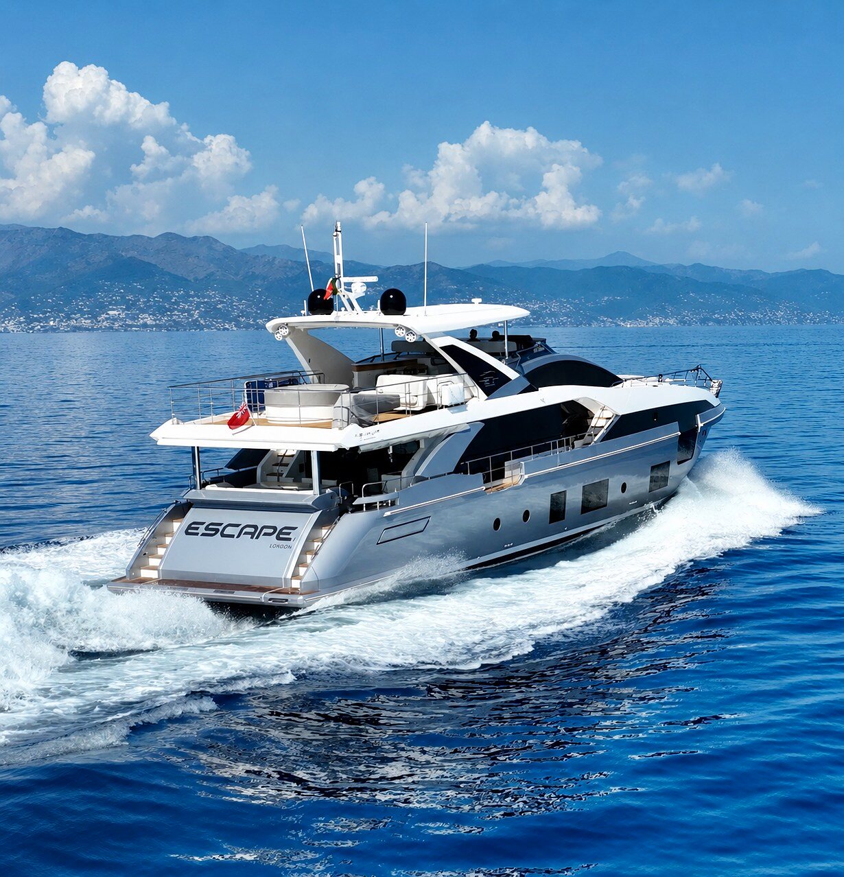 M/Y ESCAPE aft quarter view running at speed with transom name