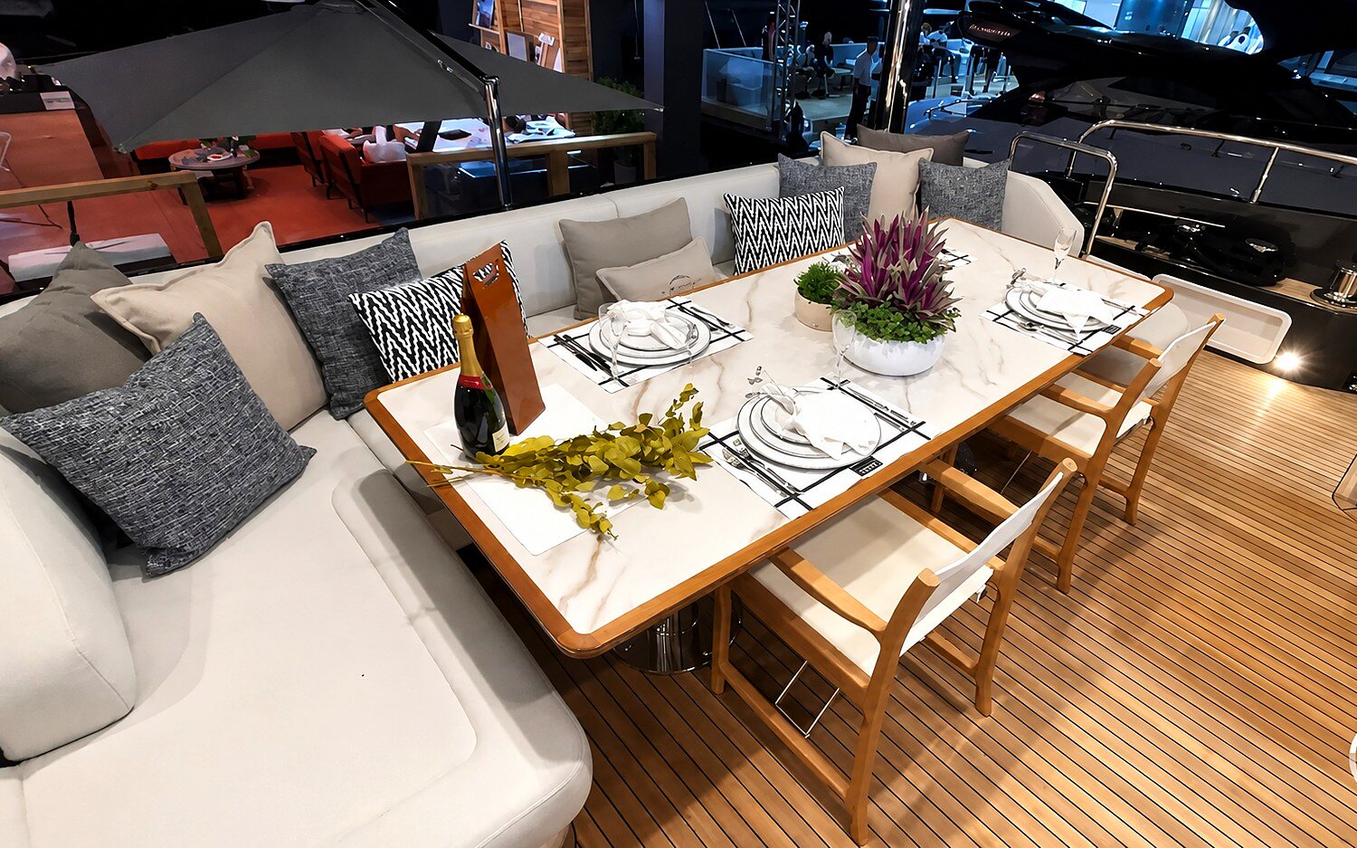 ESCAPE aft deck dining table set for guests